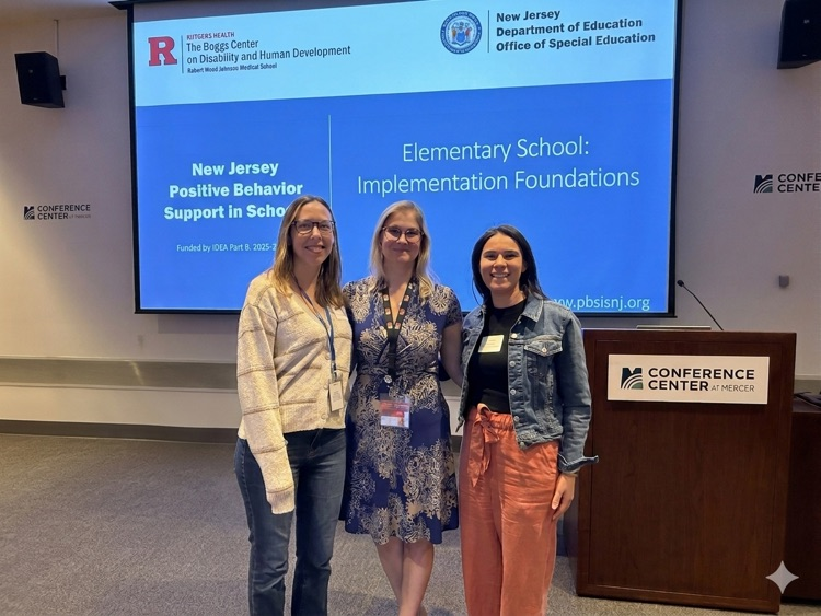 WPS staff members pictured with Rutgers PBSIS Coach