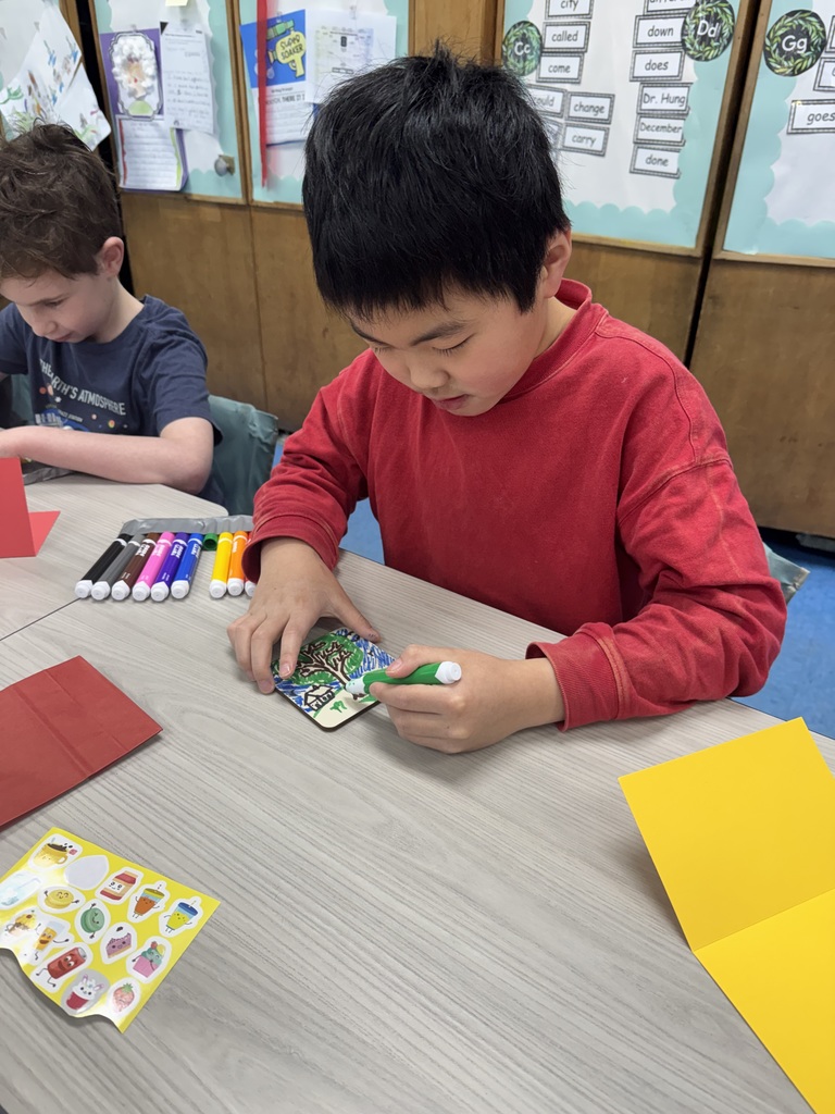 Student decorating cards.