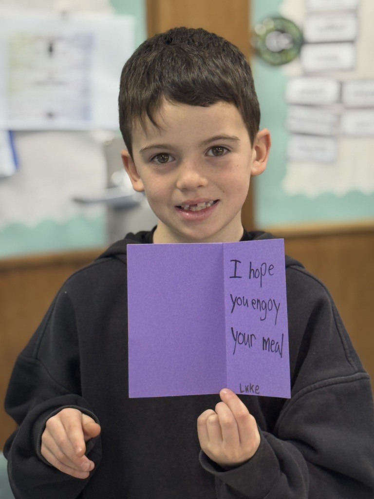 Student proud of his card.