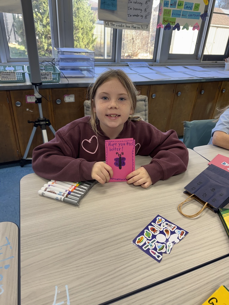 Student proud of the card she made.