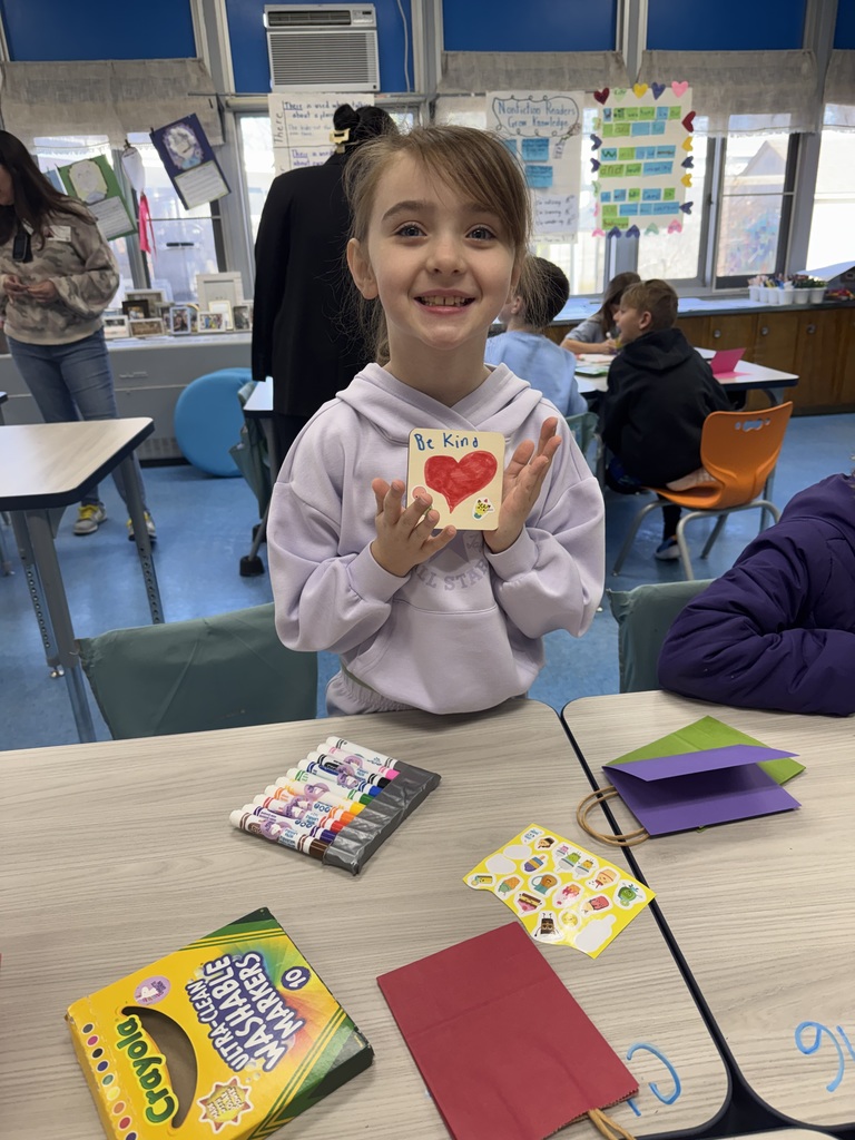 Student proud of the card she made.