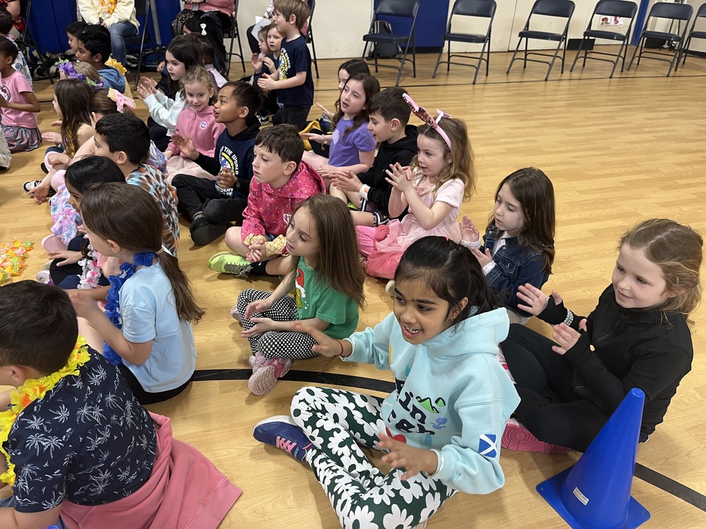 Students are clapping along to the singing.