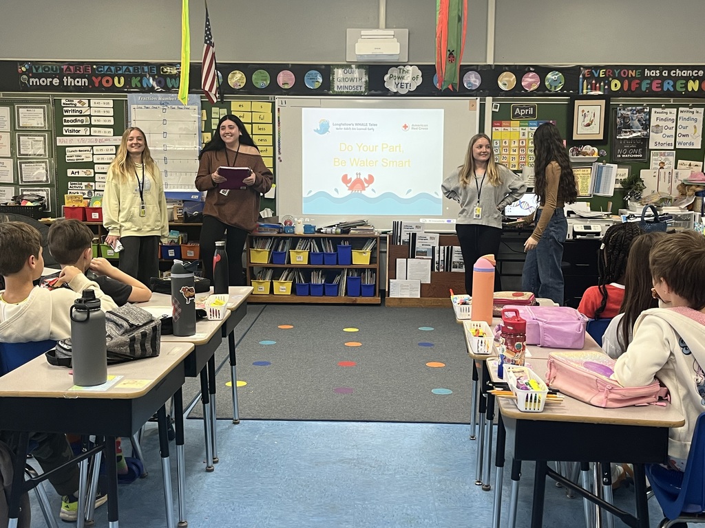 4 WHS presenters talking with our 3rd graders.