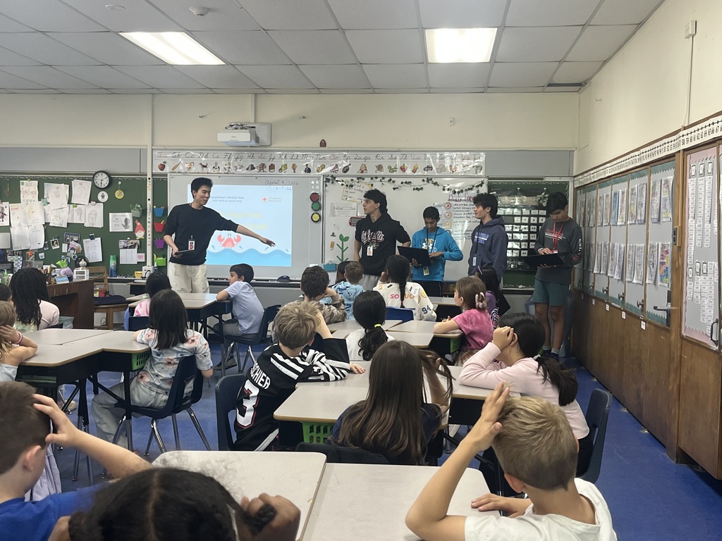 5 WHS presenters talking with our 3rd graders.