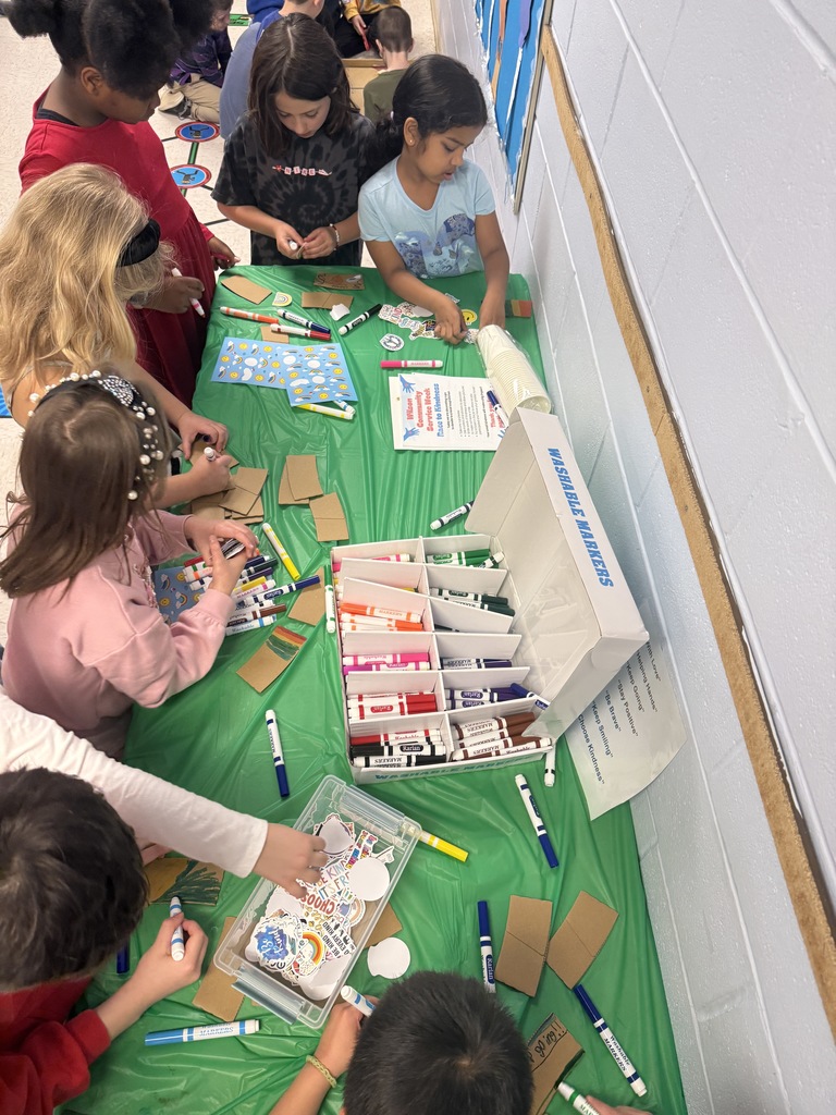students decorating cup sleeves