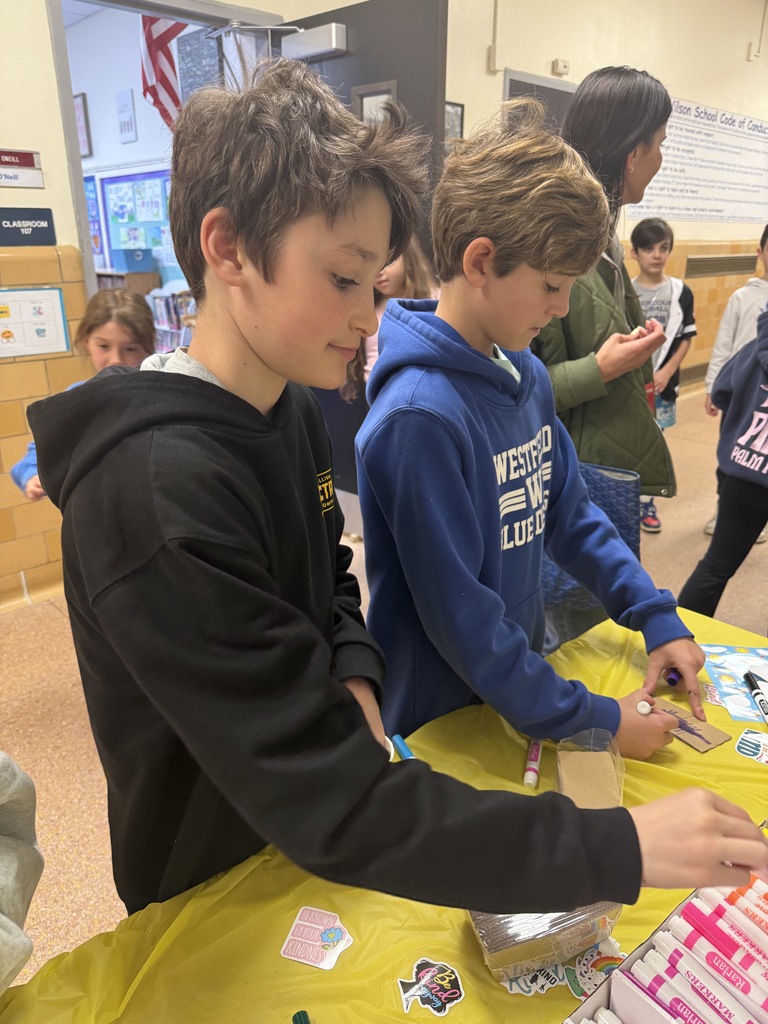 students decorating cup sleeves