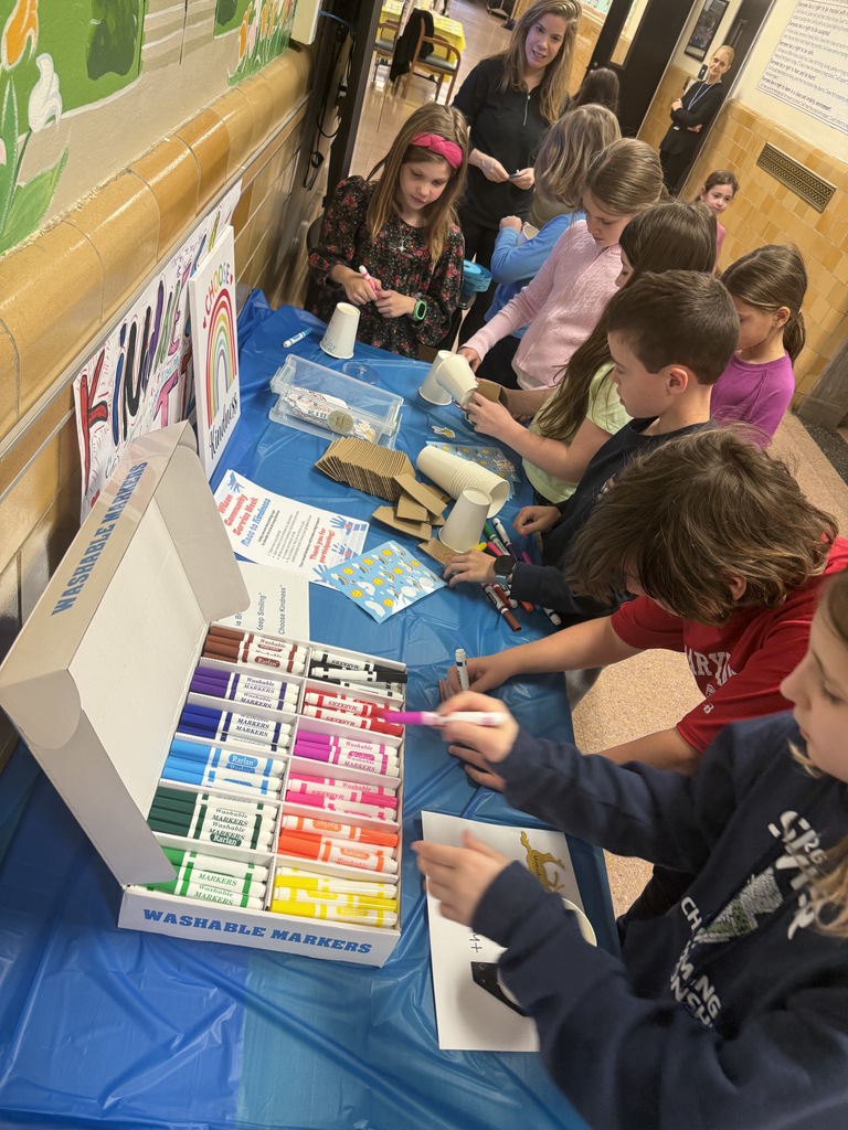 students decorating cups