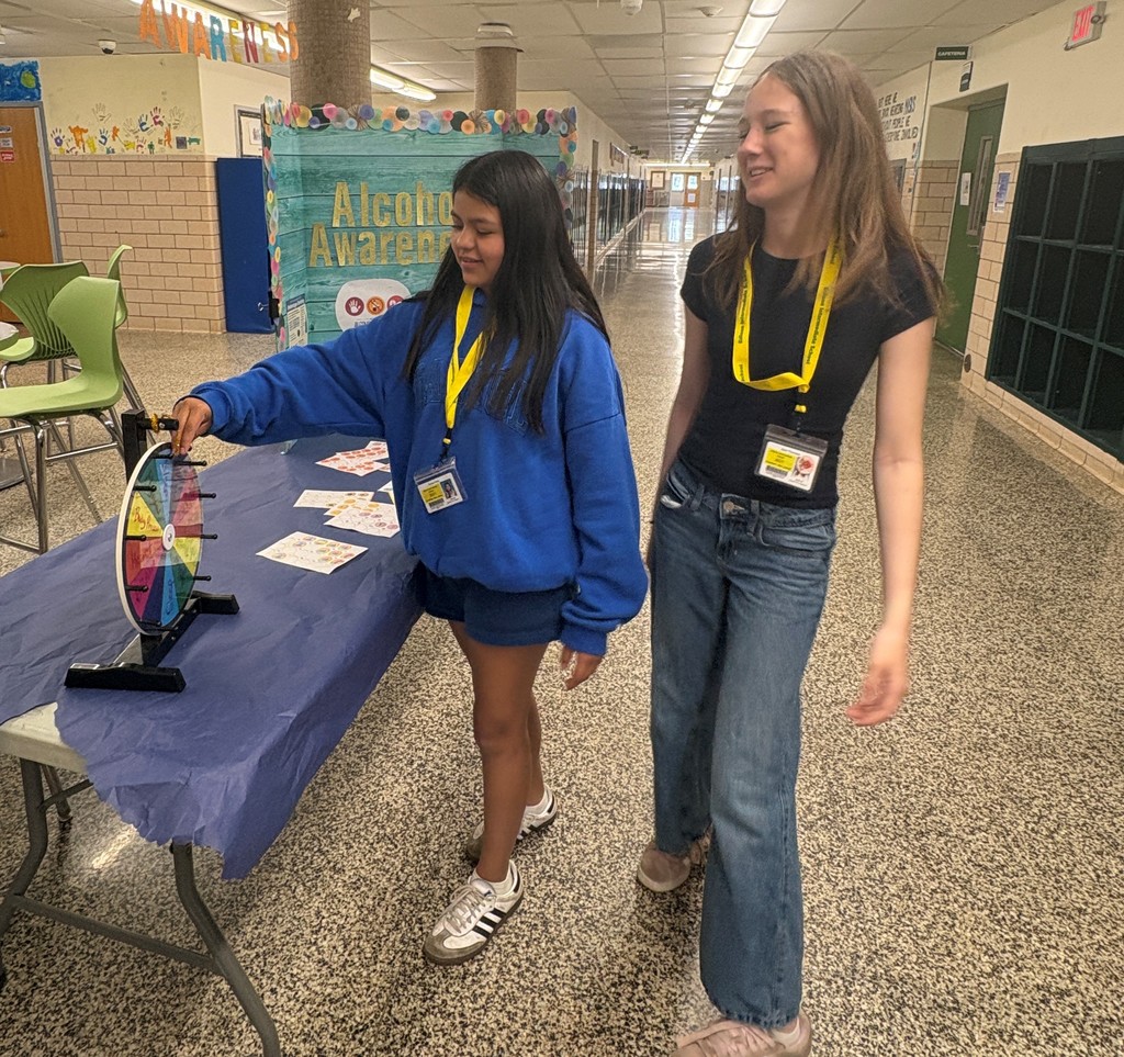 Students playing trivia with Ms. Wilson