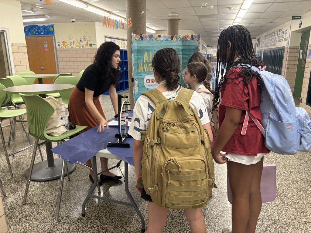 Students playing trivia with Ms. Wilson