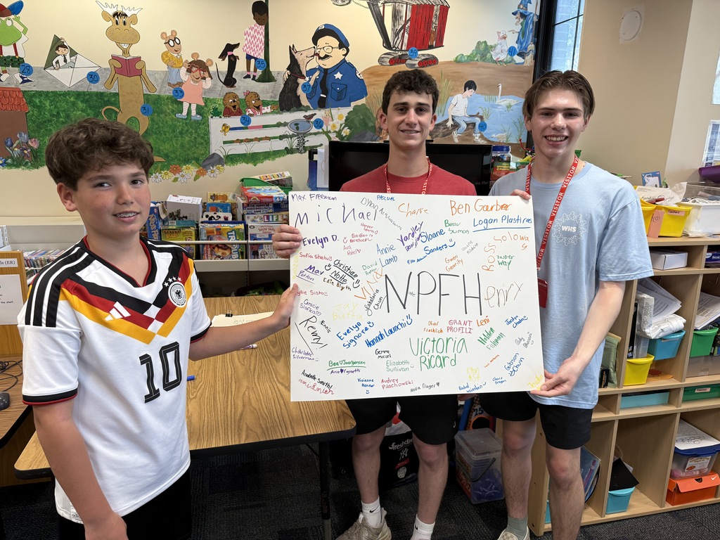students holding the signed No Place for Hate pledge