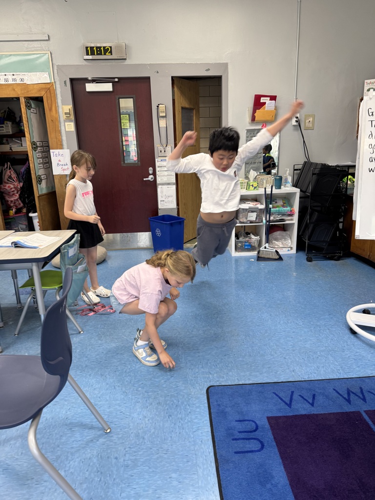 Students measuring how far they can jump.