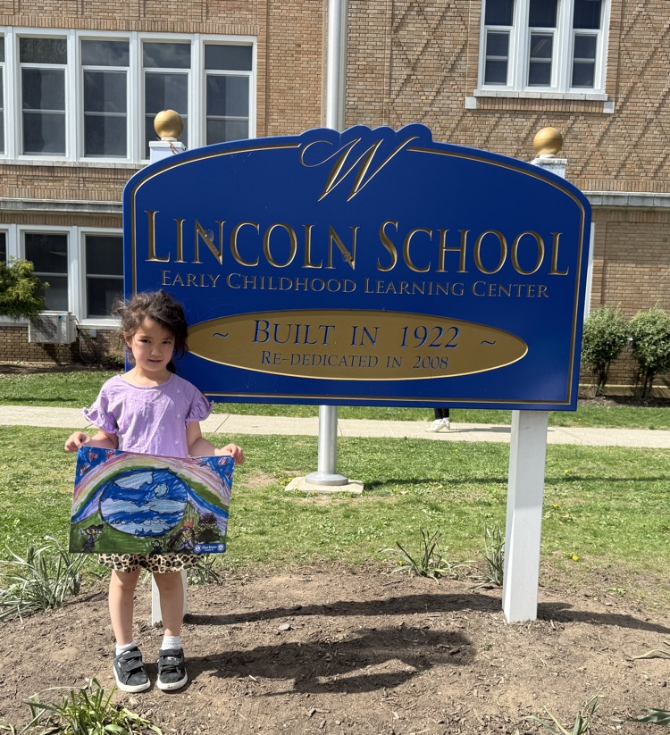 Eliana poses with her poster