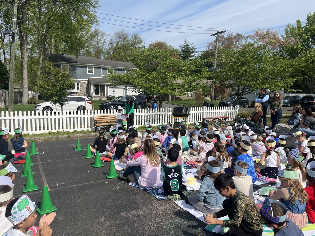 Student shares her poem as all other students listen.