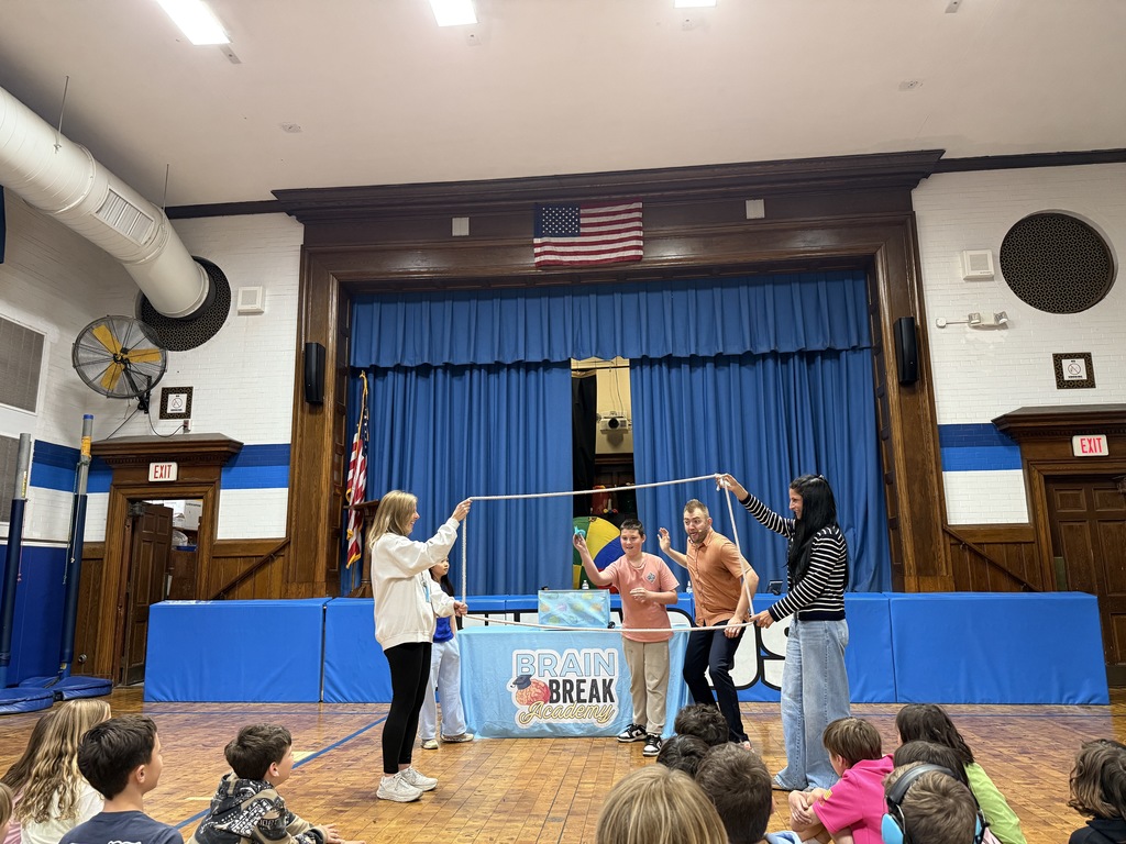 2 students and 2 teachers participating in  Brain Break assembly
