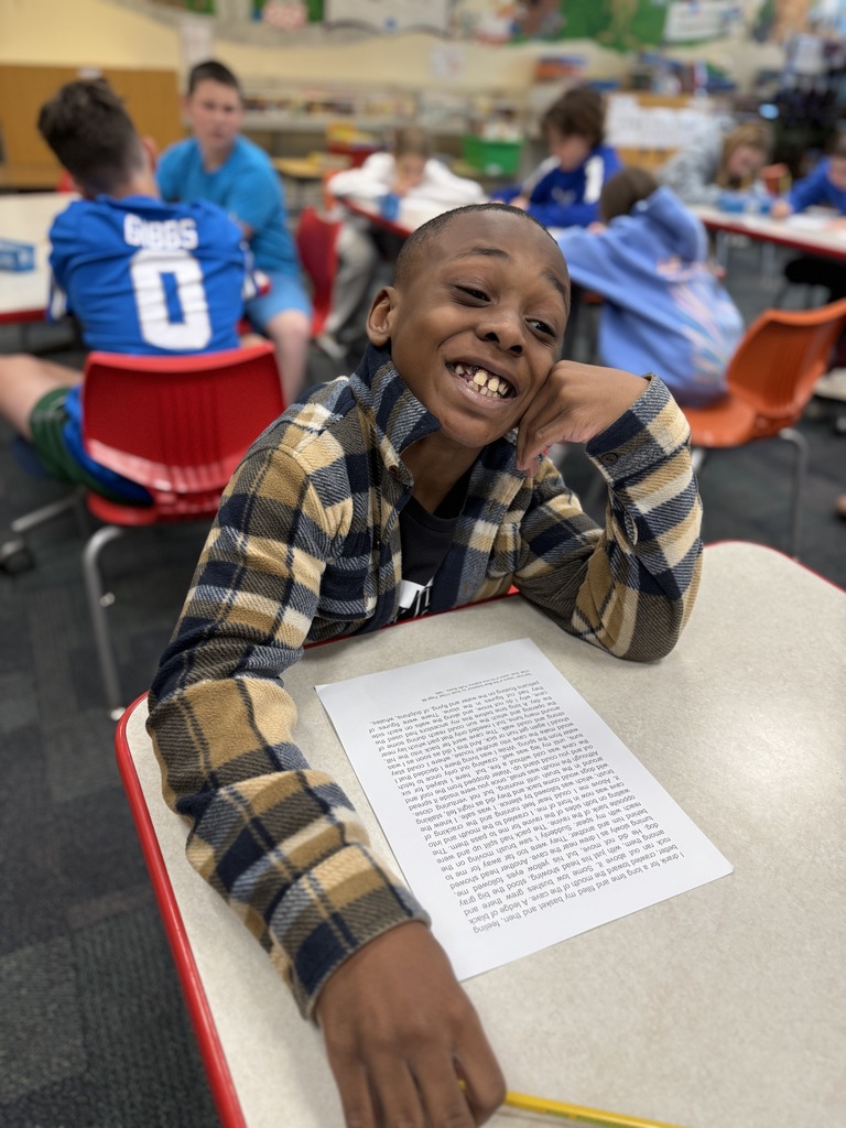 student creating a Black-Out poem