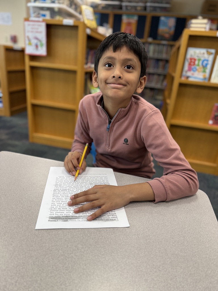 student creating a Black-Out poem