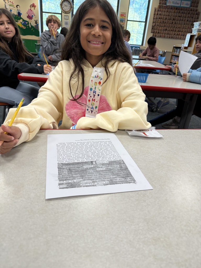 student creating a Black-Out poem