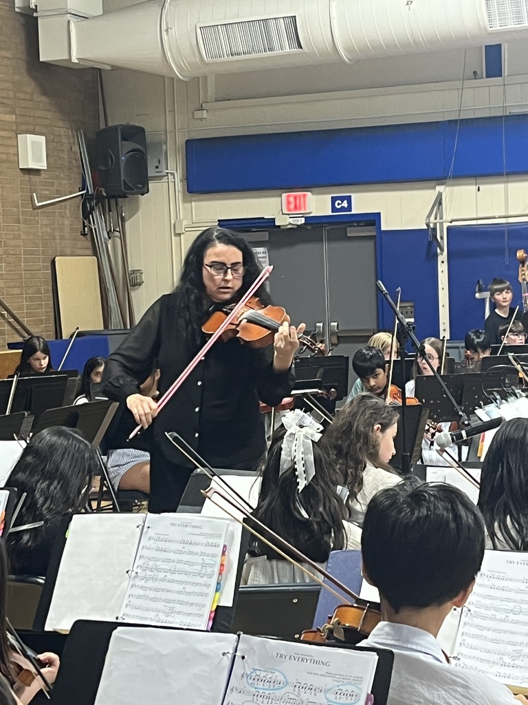 Mrs. Naylor joins in the performance