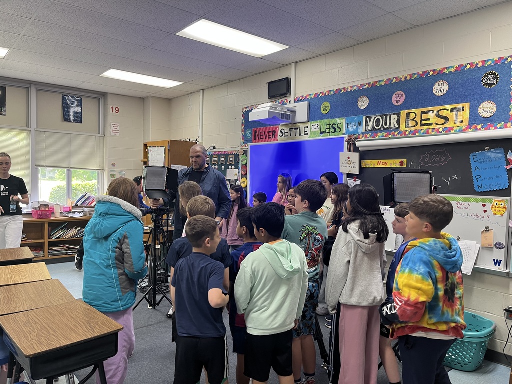 Mr. Alongi speaking with the students and showing him the equipment.