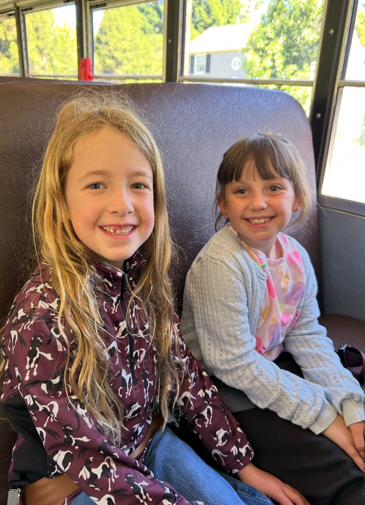 students sitting on the bus