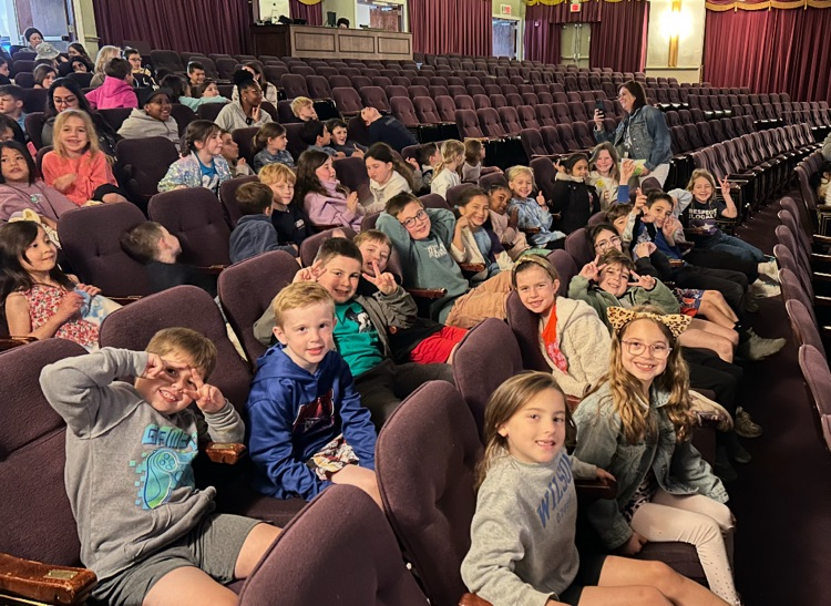 students sitting in the theater