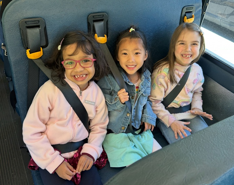 students sitting on the bus