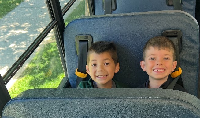 students sitting on the bus