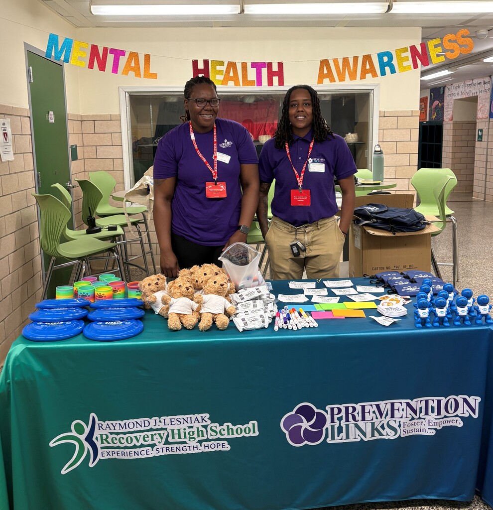 Guests from Prevention Links hosting positive affirmations  table