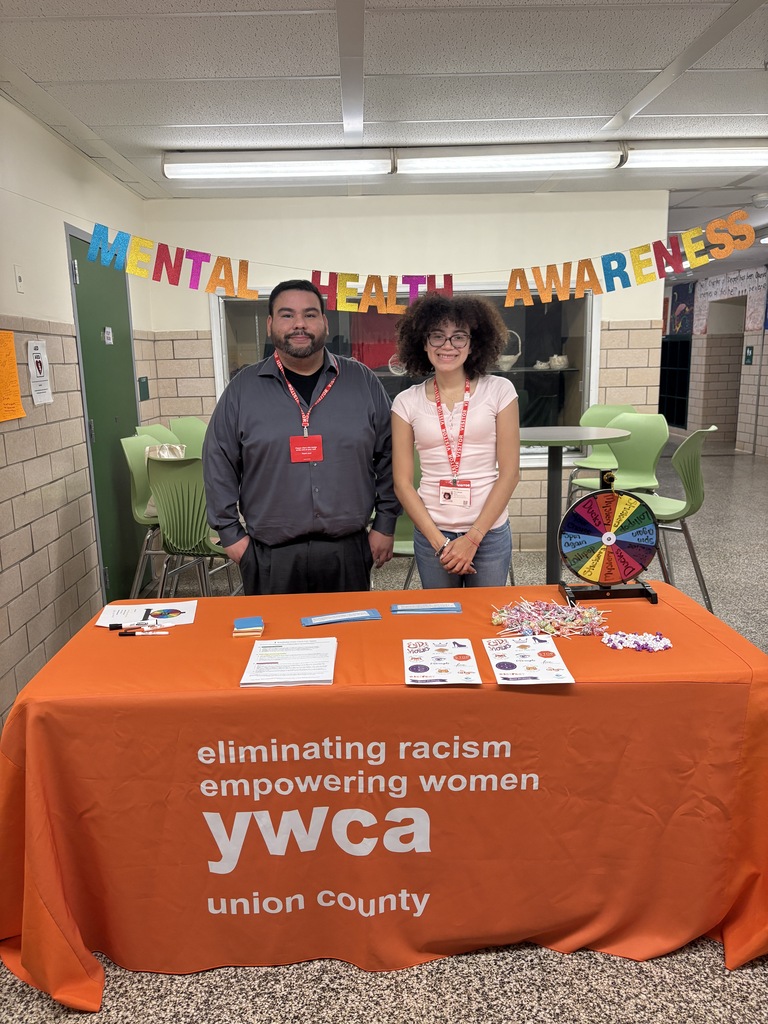 Guests from YWCA hosting healthy relationships table