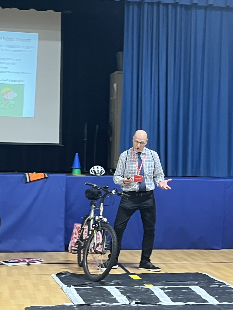 Presenter shares the importance of riding with others but maintain a safe distance