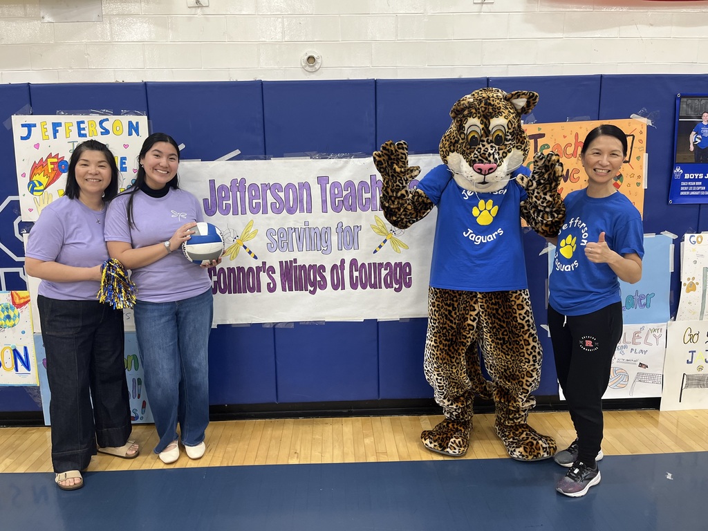 Jazzy and Dr. Hung are photographed with representatives from Connor's Wings of Courage in front of the beautiful banner