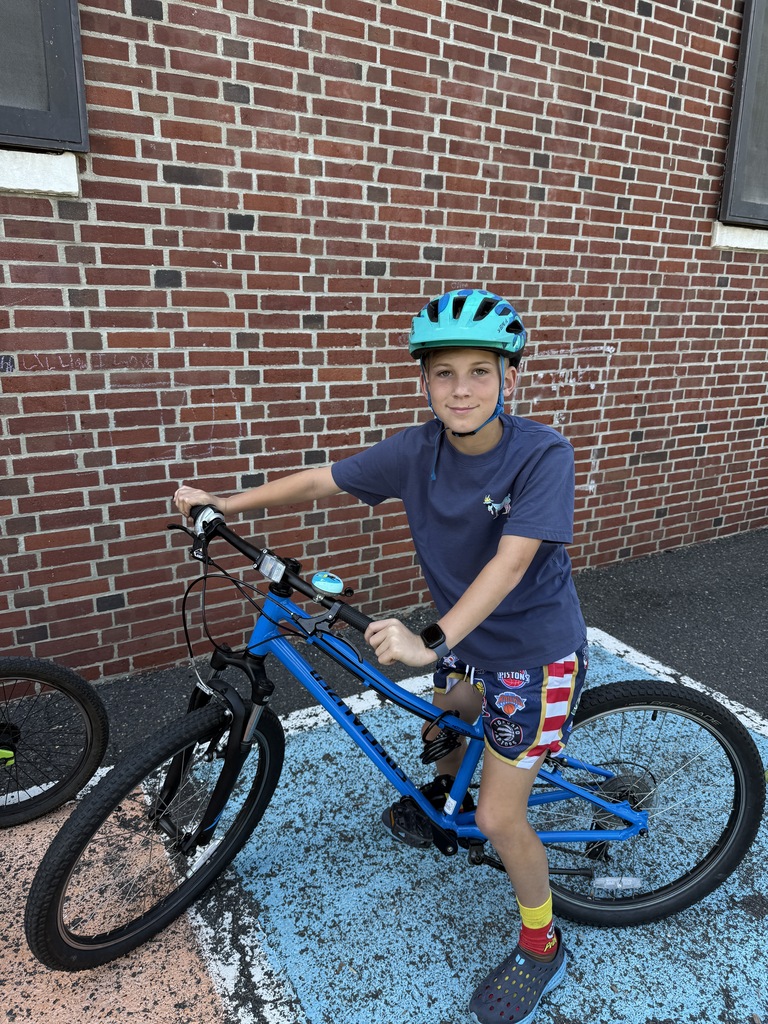 student holding bike