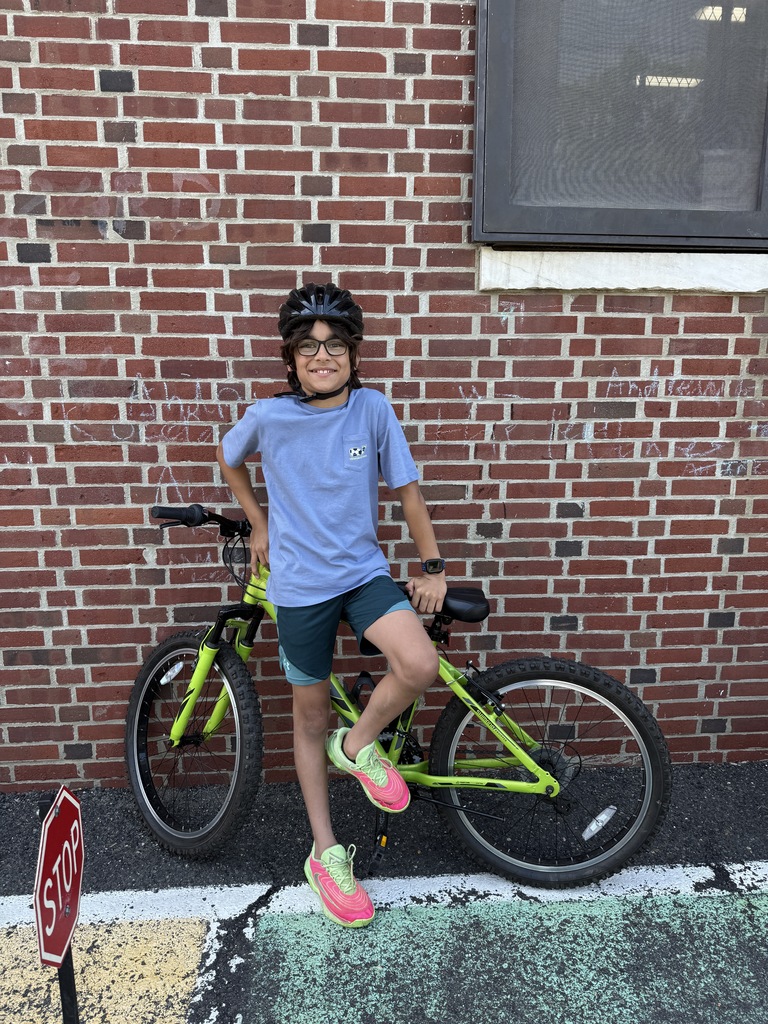 student holding bike