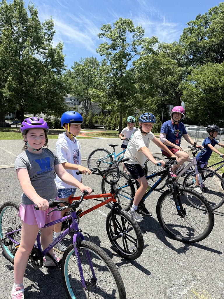 students and EZ Ride presenter holding their bikes