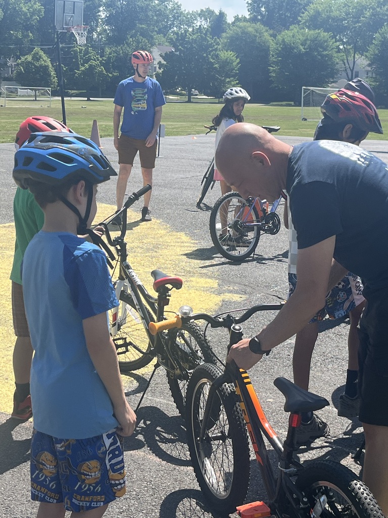 John from Jay Cycle help adjust the seat for a student. 