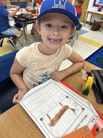 students engaged in reading their All About books