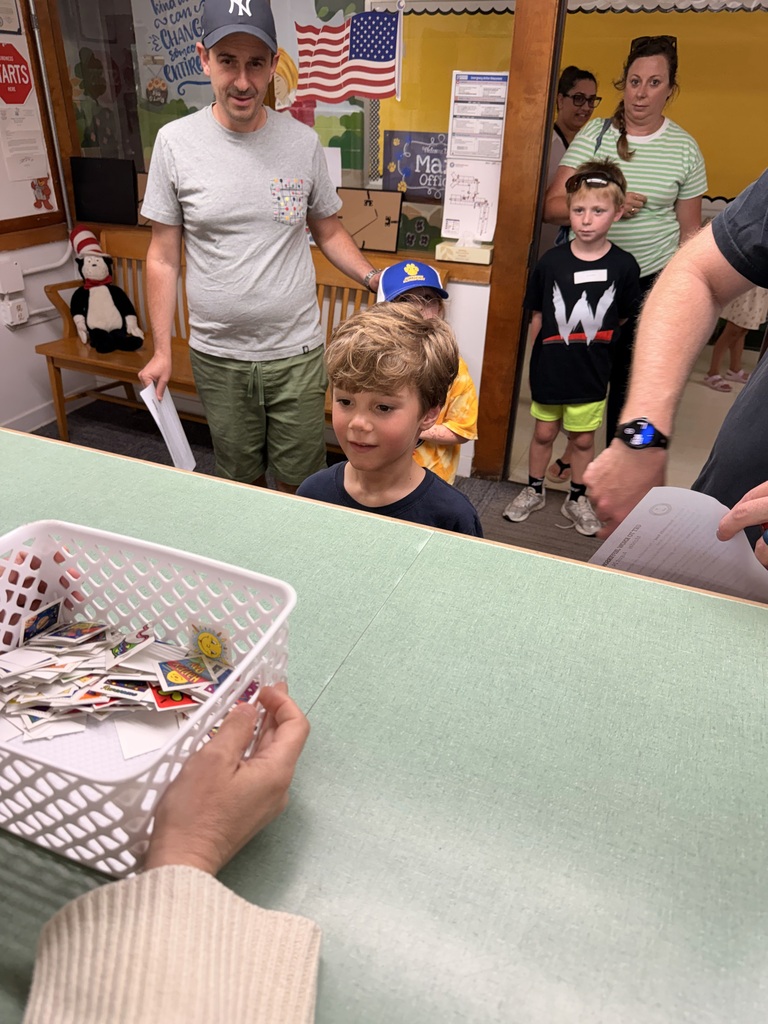 Students meet the secretary and politely ask for a sticker.