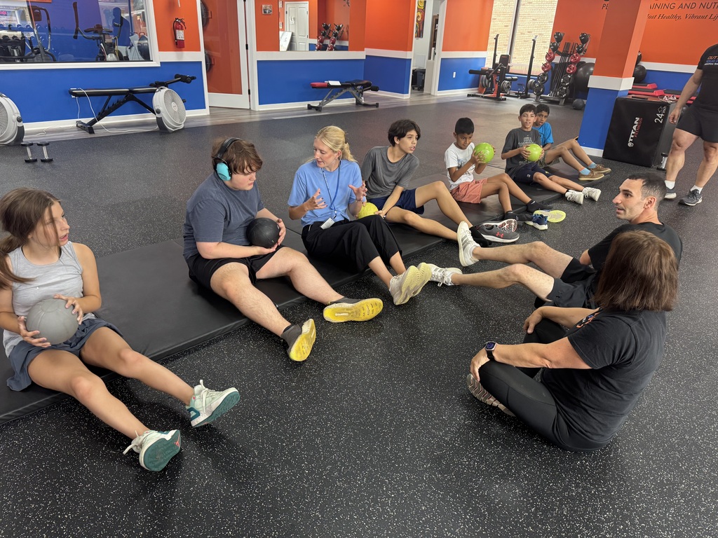 Students working with a trainer