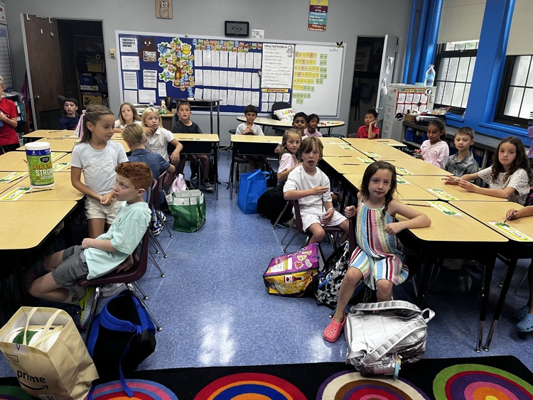 students starting their day in classrooms