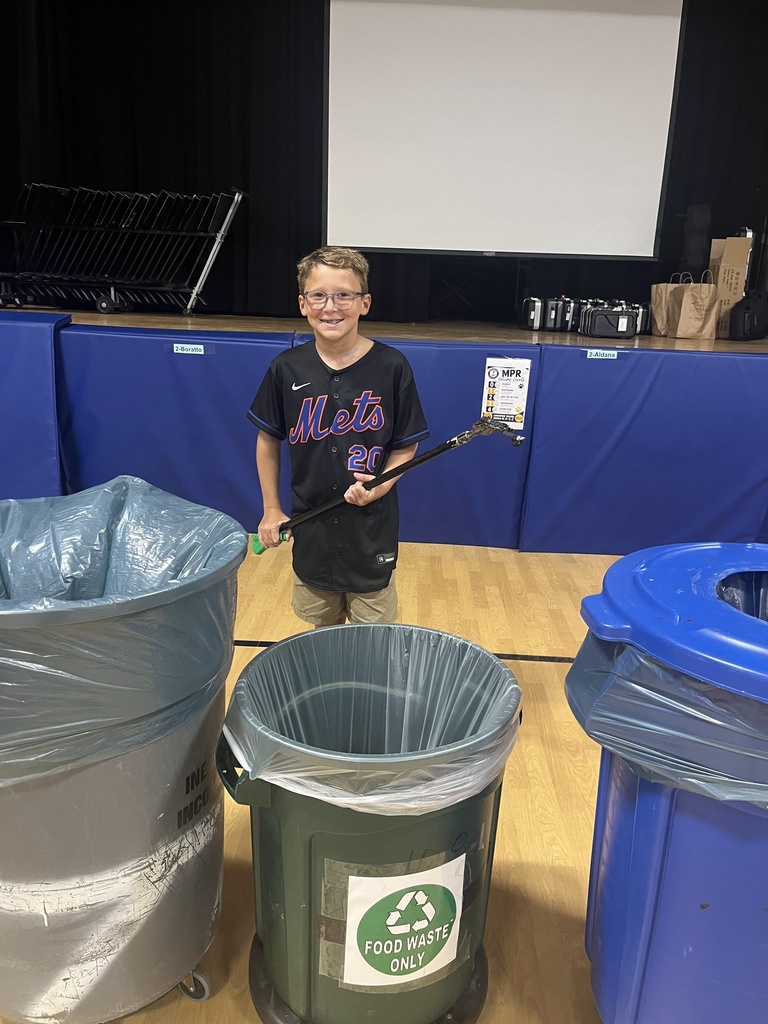 4th grader is happy to help with food waste recyling.