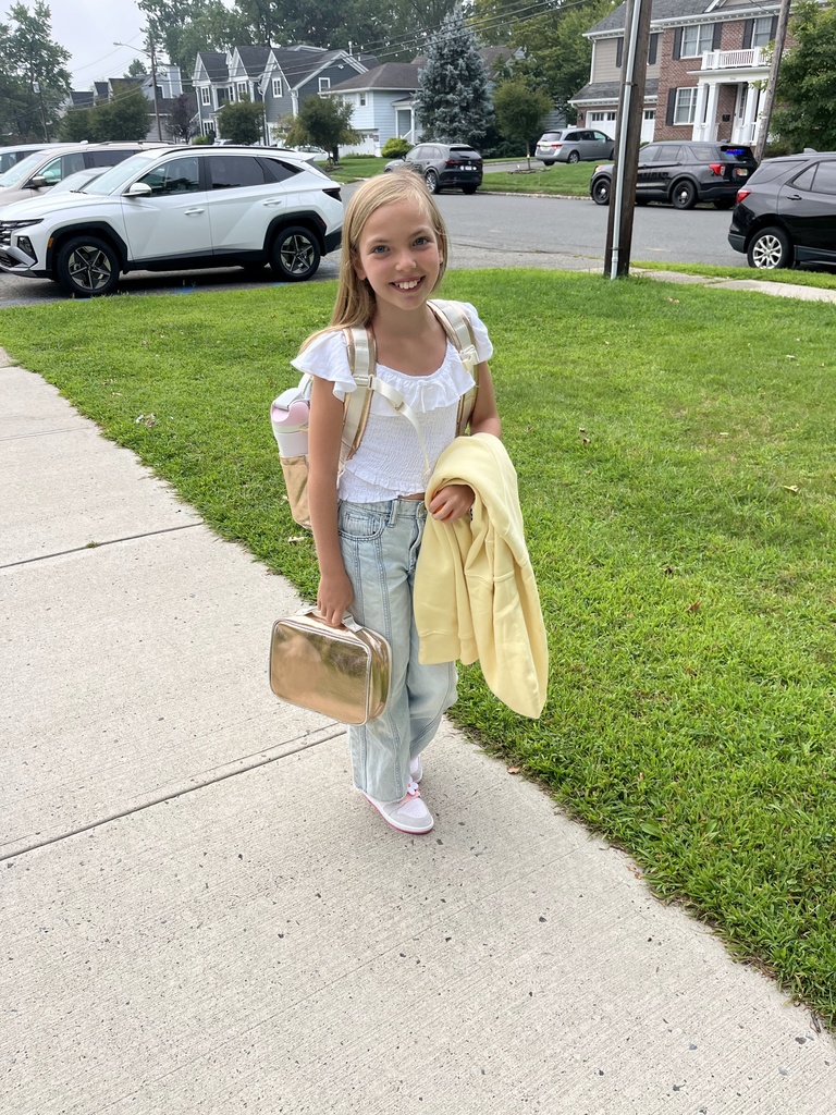 5th grader is happy to be at school.