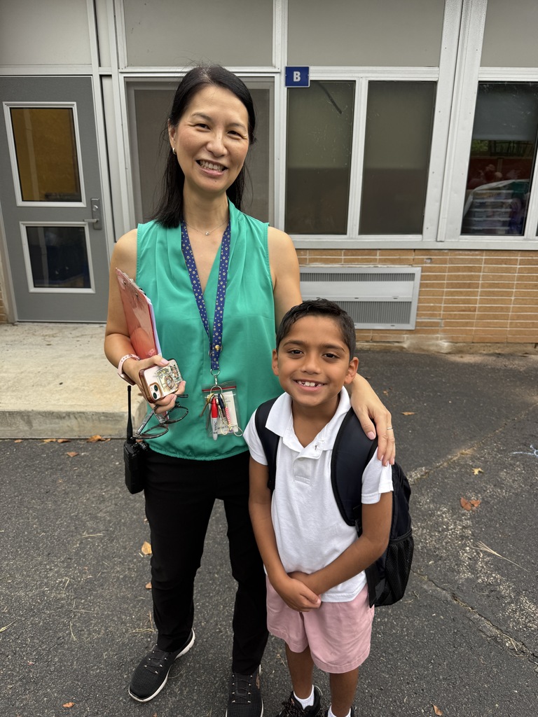 Principal is happy to greet a 2nd grader.
