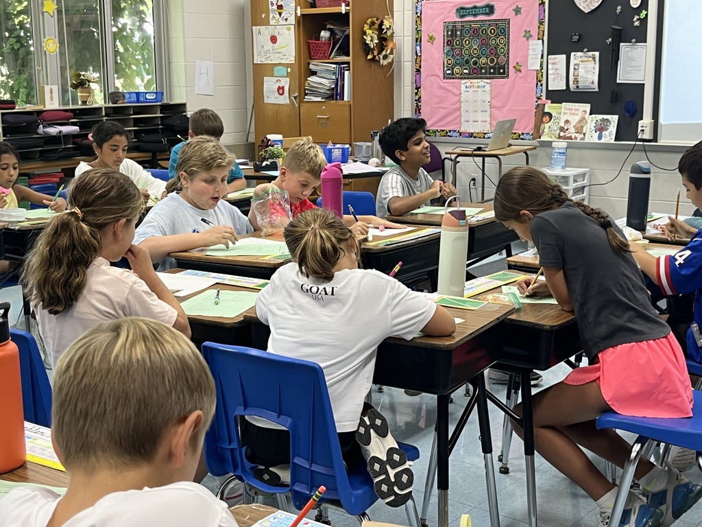 Students completing their math work.
