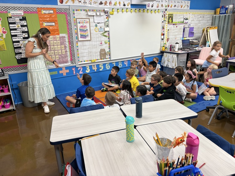 students listening to teacher