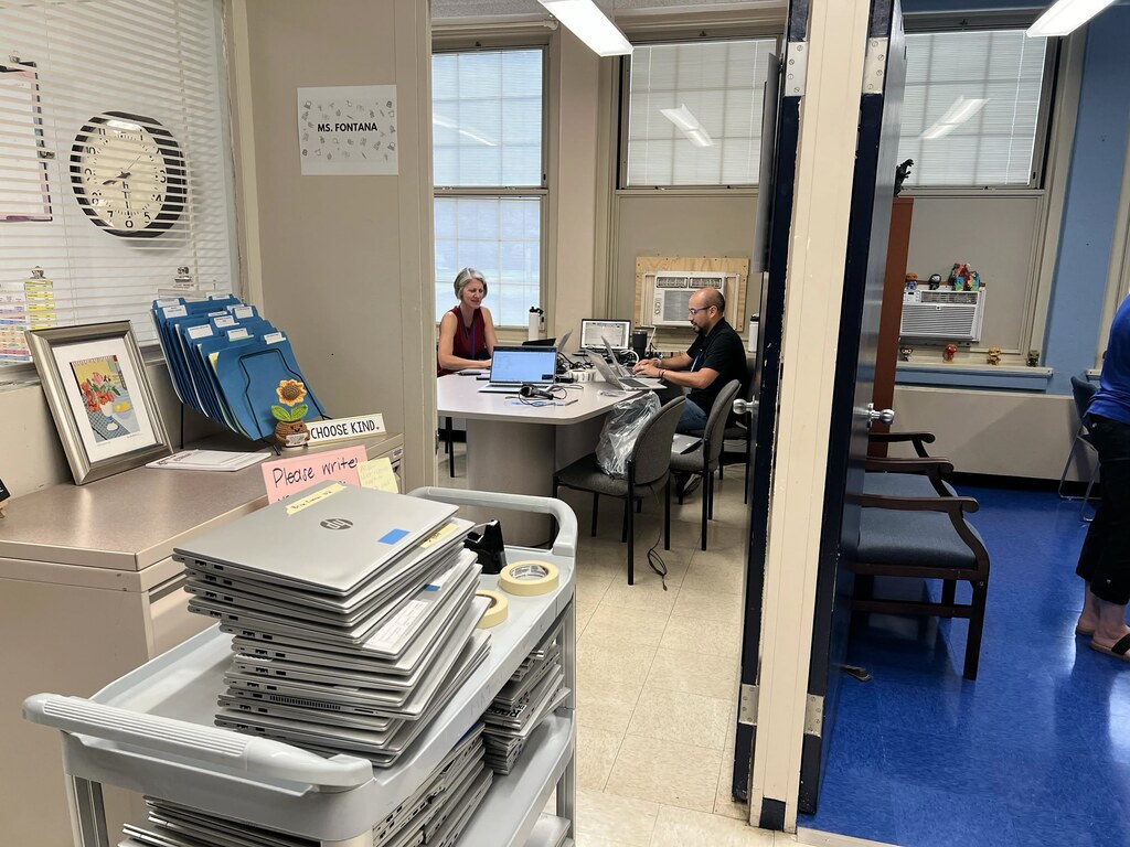 Tech team working on computers.