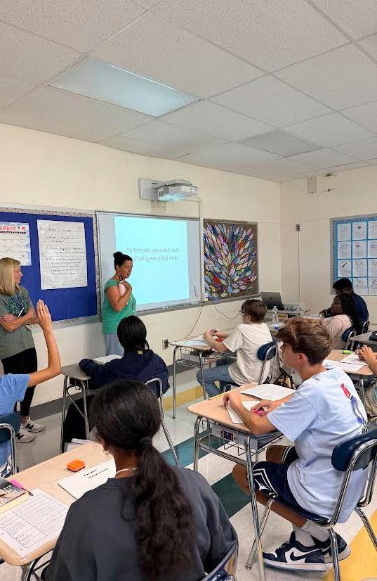 two teachers in front of a class