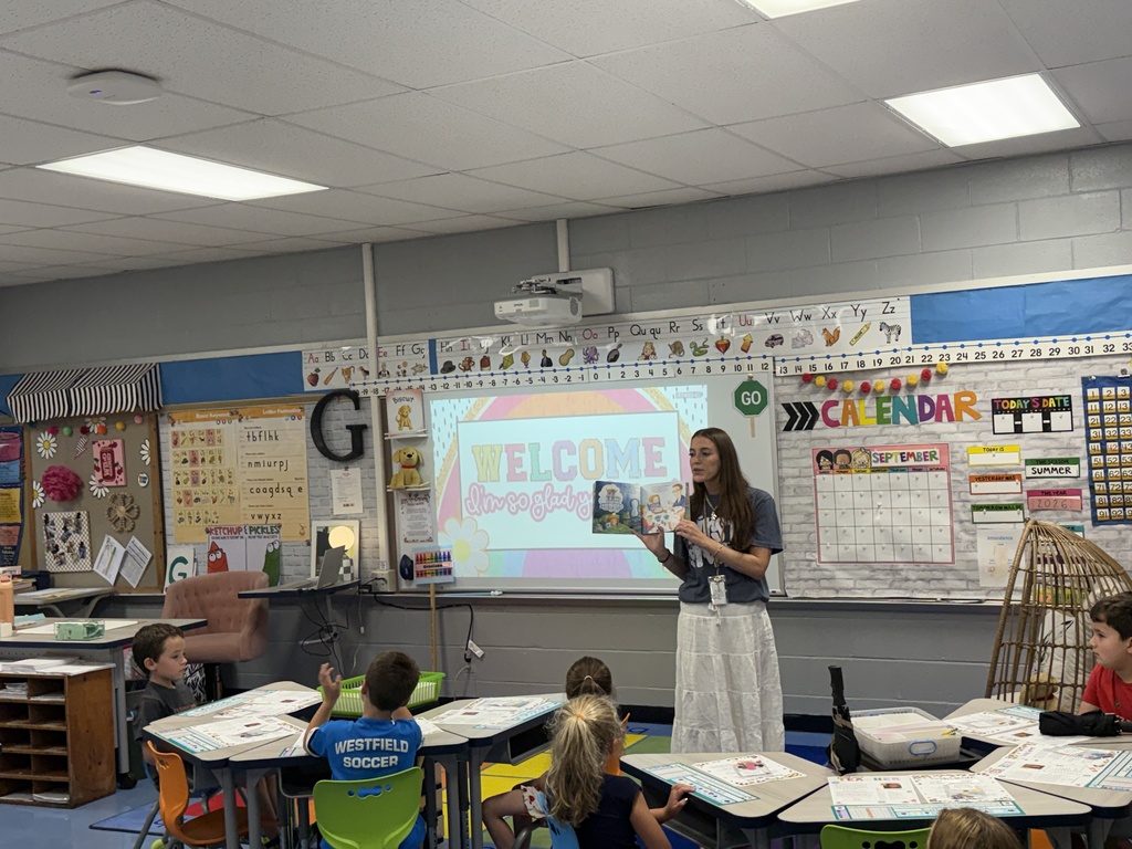 first grade teacher reading to the class