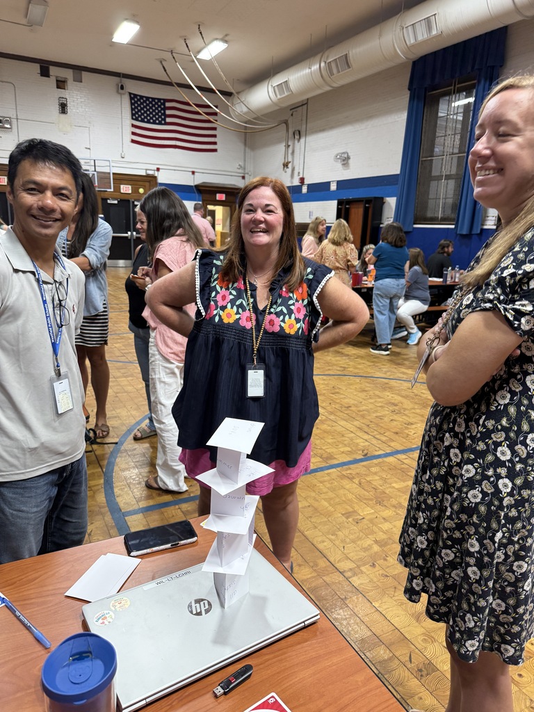 Wilson staff, standing, working together