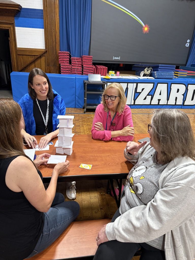 wilson staff , sitting, working together