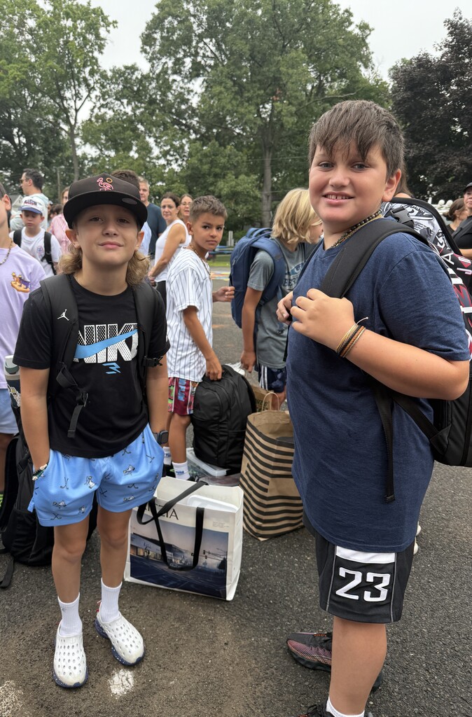 two boys standing during arrival on the first day of school